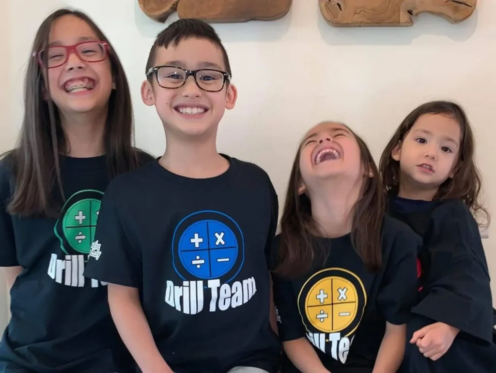 four Drill Team students enjoying learning math facts with Nicole the Math Lady's program